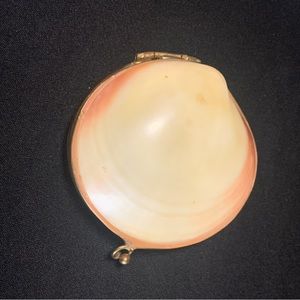Vintage hand crafted kiss lock clam shell which is white with pink highlights